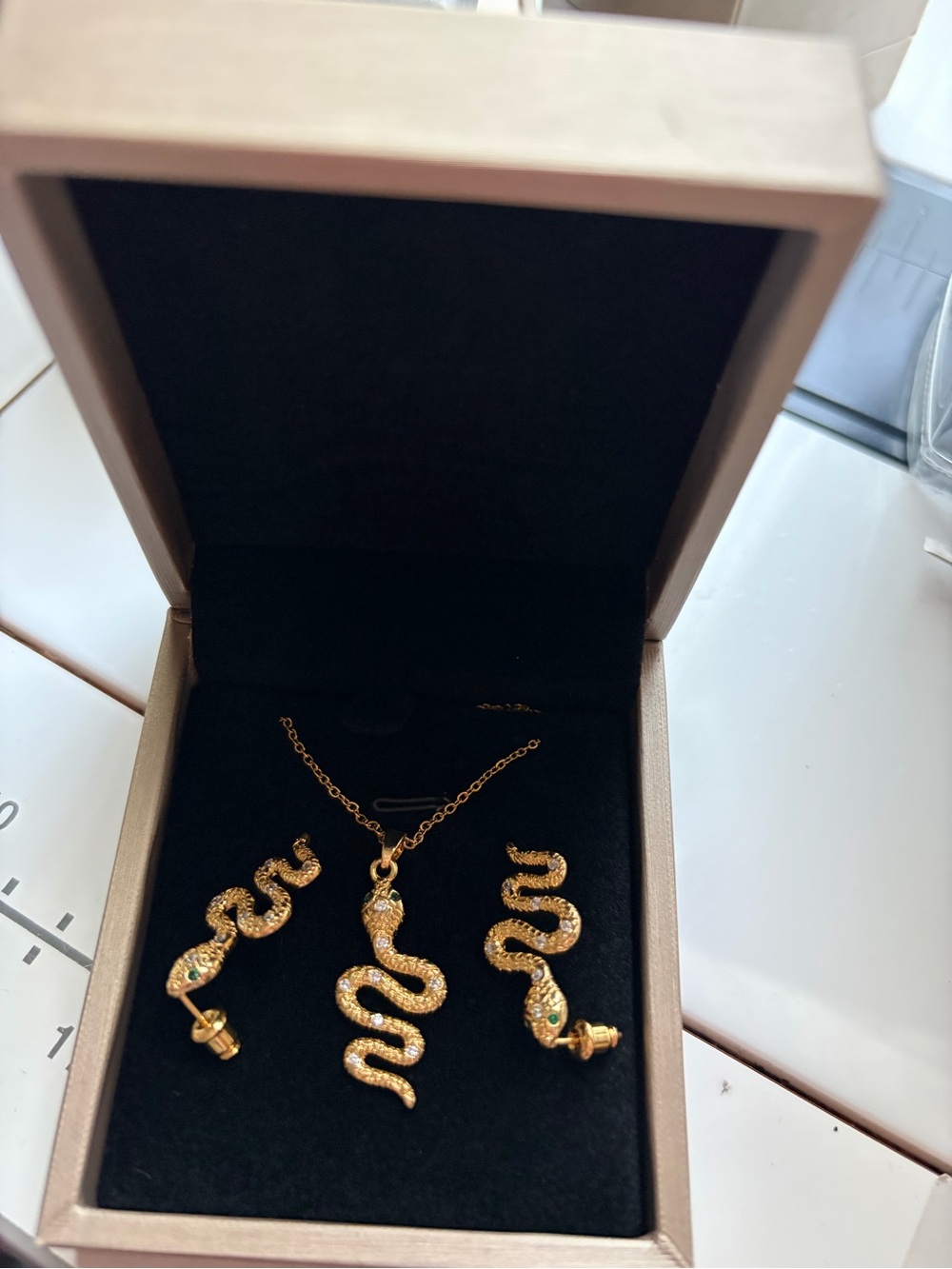 Gold snakes necklace and earrings